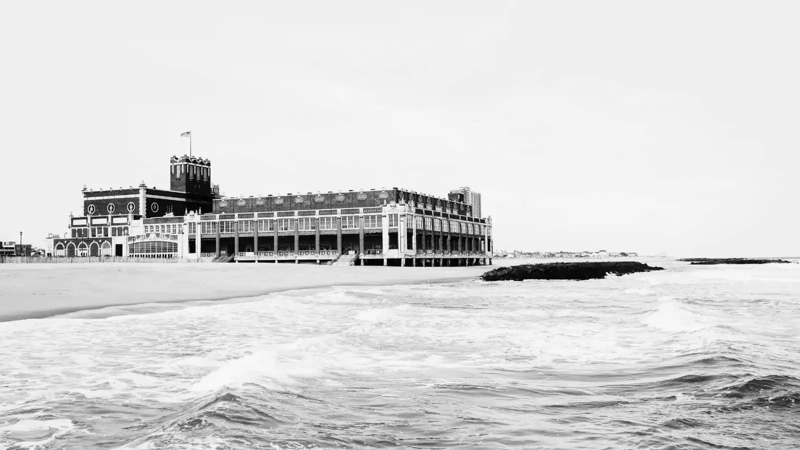 Black-and-white photo of Convention Hall and the beach in Asbury Park, NJ